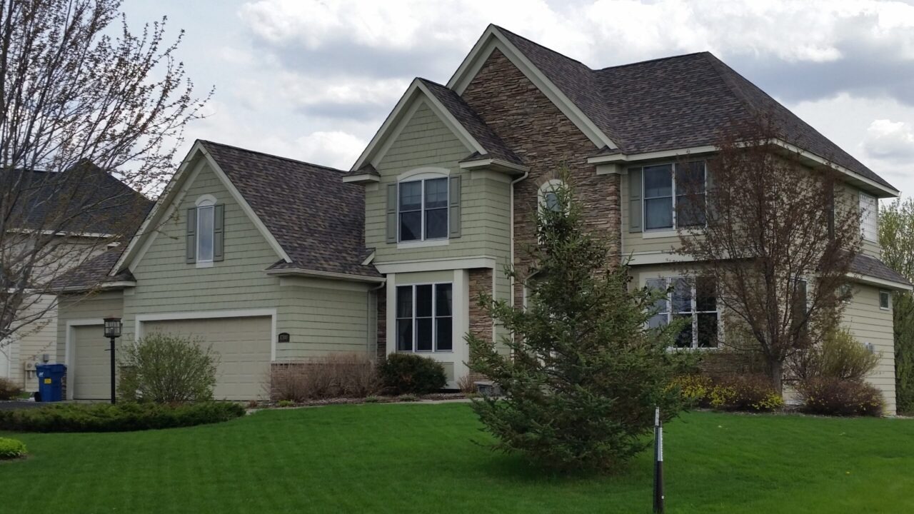 Before - Wind-damaged vinyl siding replacement in Omaha, NE